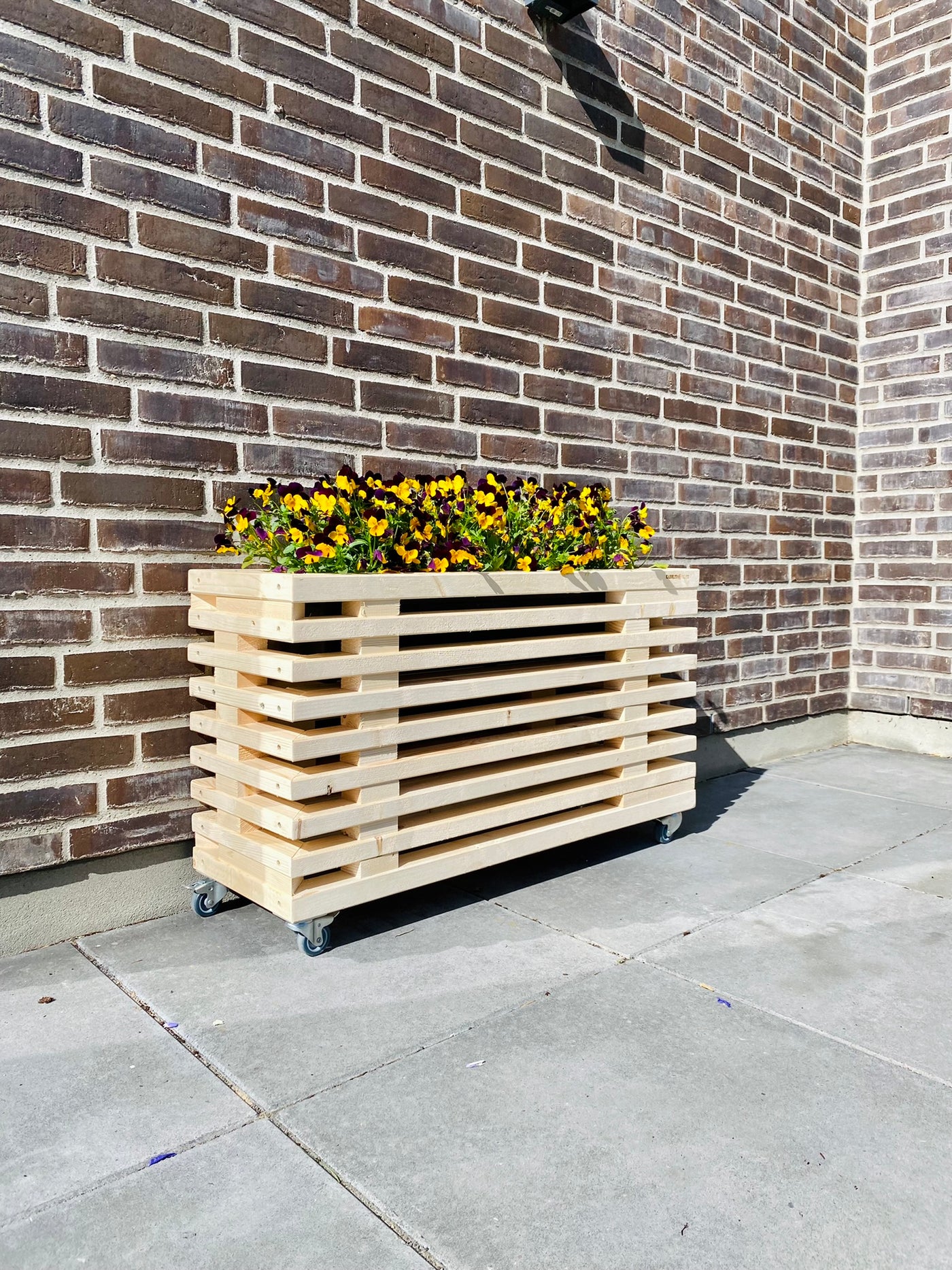 Blomsterkasse af Nye Traller